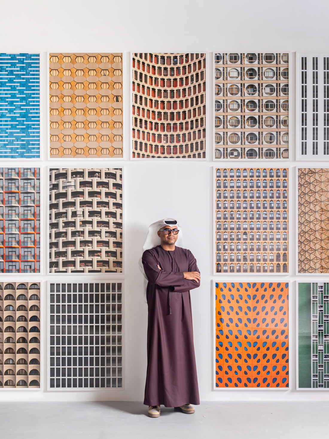 Hussain AlMoosawi in front of his Facade to Facade prints