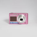 Samsung DV150F pink digital camera — front view with lens extended
