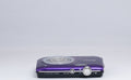 Nikon Coolpix S2600 purple digital camera — bottom view with baseplate (unit 2)