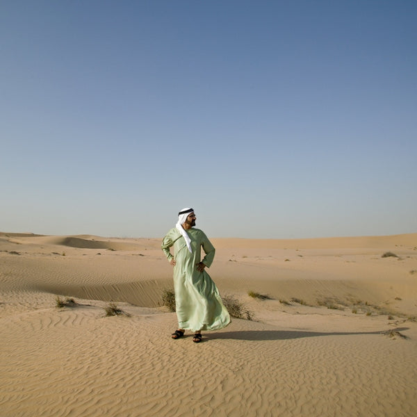 Portrait of His Highness Sheikh Mohammed bin Rashid Al Maktoum Standing In The Desert
