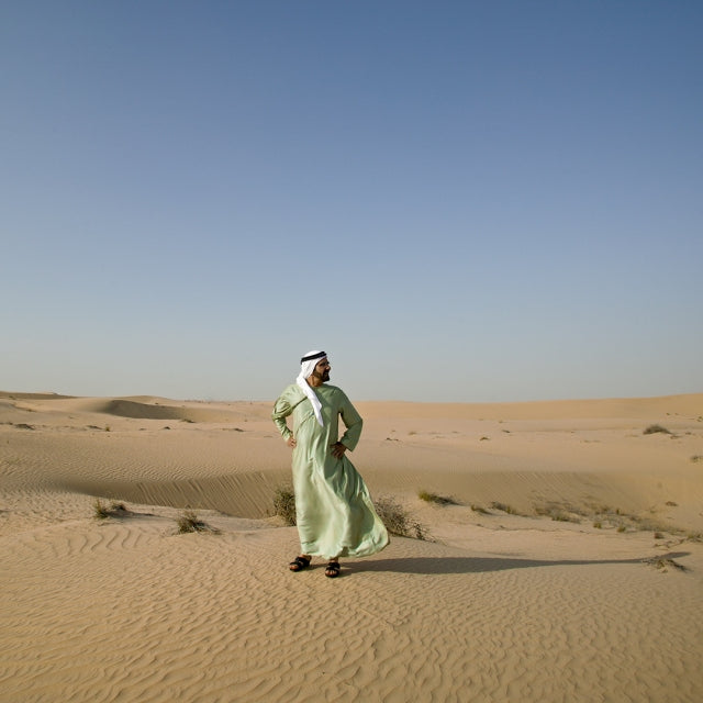 Portrait of His Highness Sheikh Mohammed bin Rashid Al Maktoum Standing In The Desert