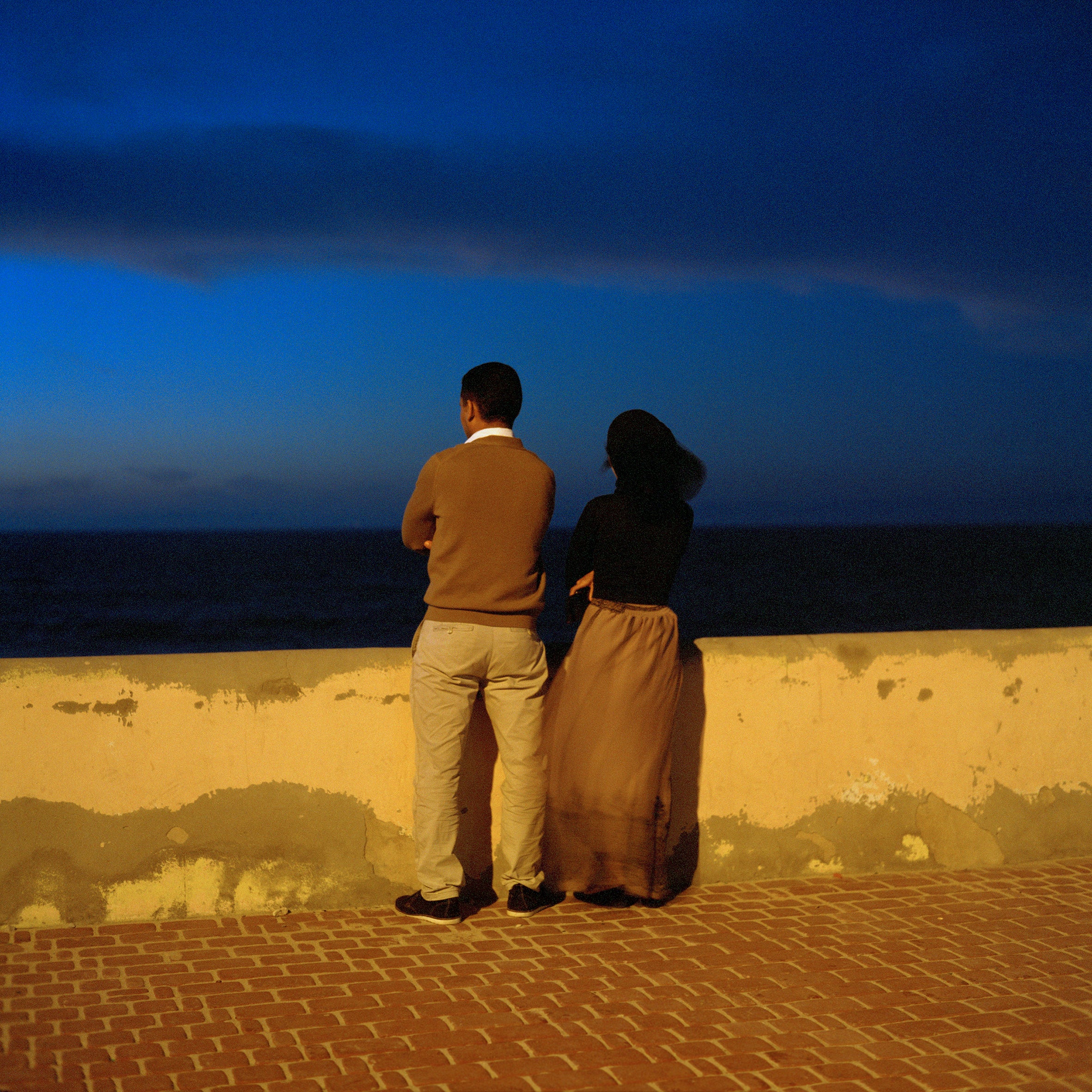 Couple Gazing at the Sea at Dusk