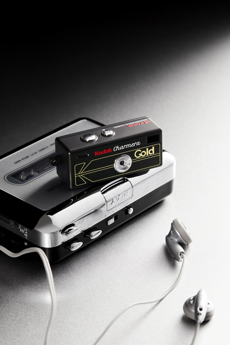 Kodak Charmera Millennium — handheld portrait, charm-keychain detail